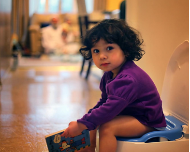 Photograph of a child potty training